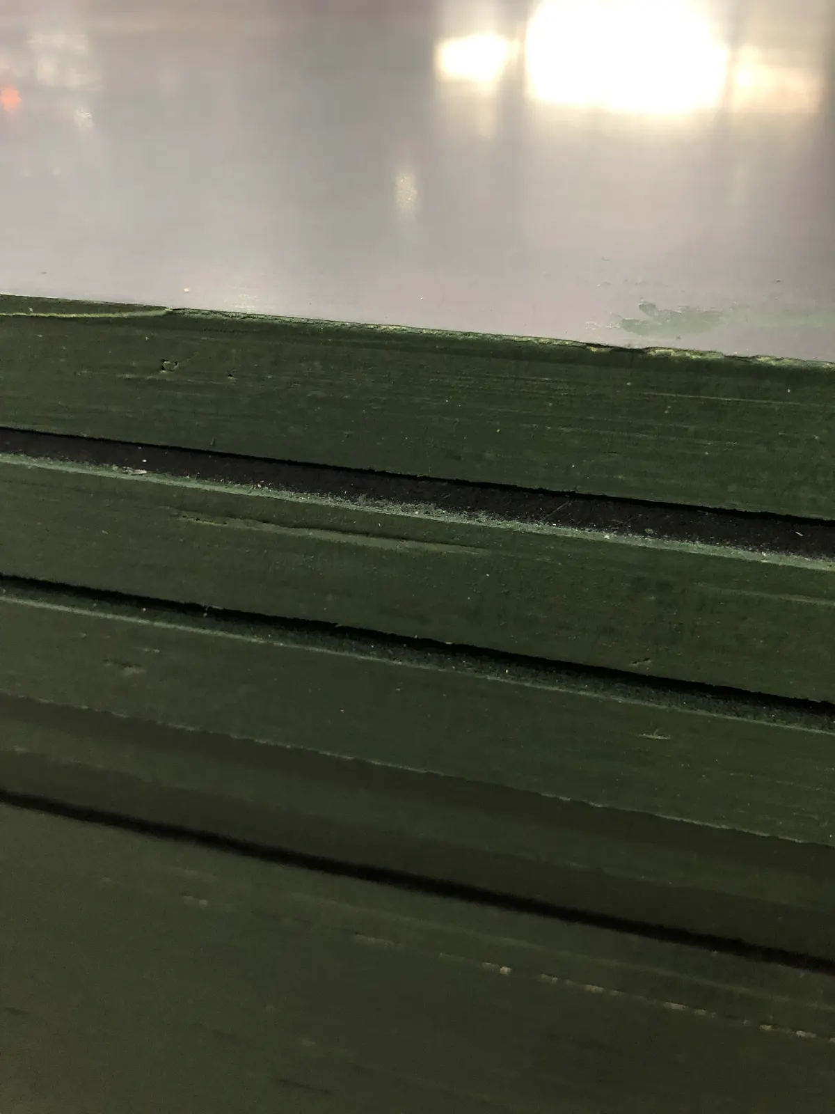 Formply sheet edges showing sealed green edge coating